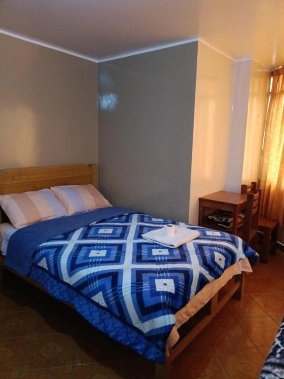 Cama o camas de una habitación en Hospedaje Escorpio