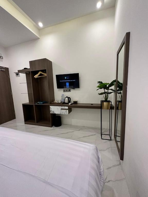 TV a/nebo společenská místnost v ubytování Resong Hotel
