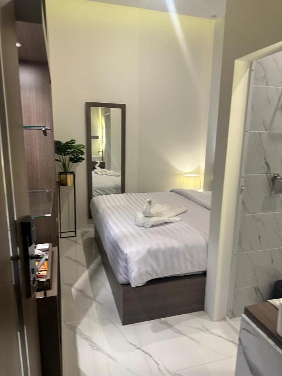 Postel nebo postele na pokoji v ubytování Resong Hotel