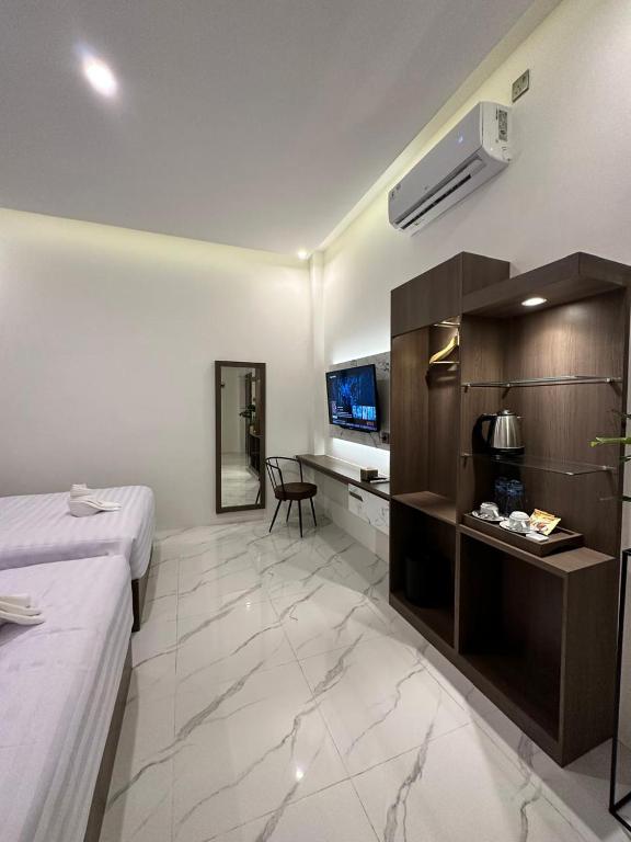 Postel nebo postele na pokoji v ubytování Resong Hotel