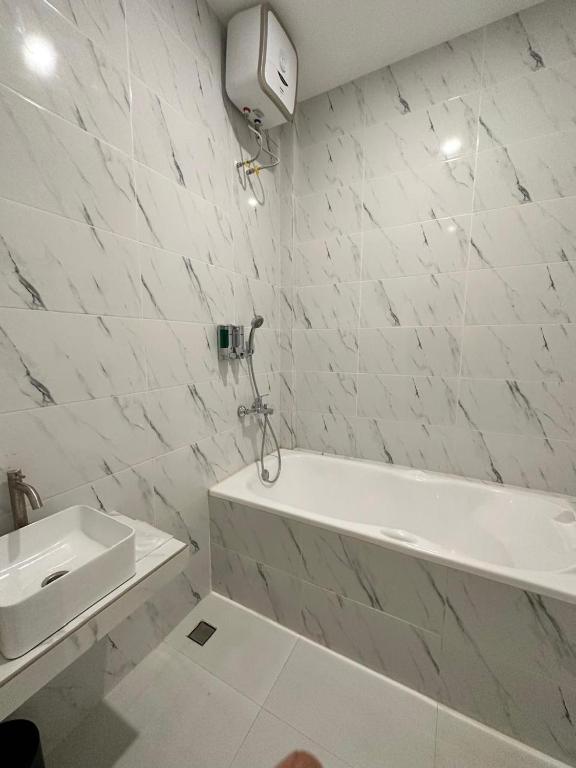 Koupelna v ubytování Resong Hotel