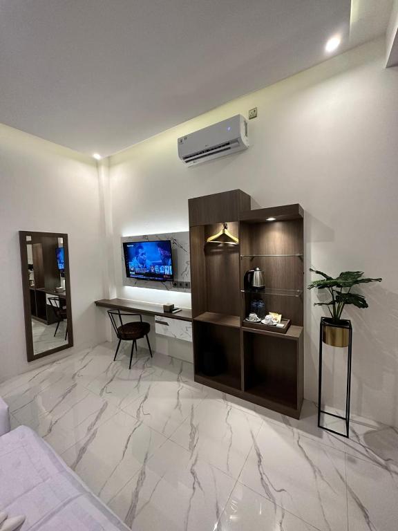 TV a/nebo společenská místnost v ubytování Resong Hotel