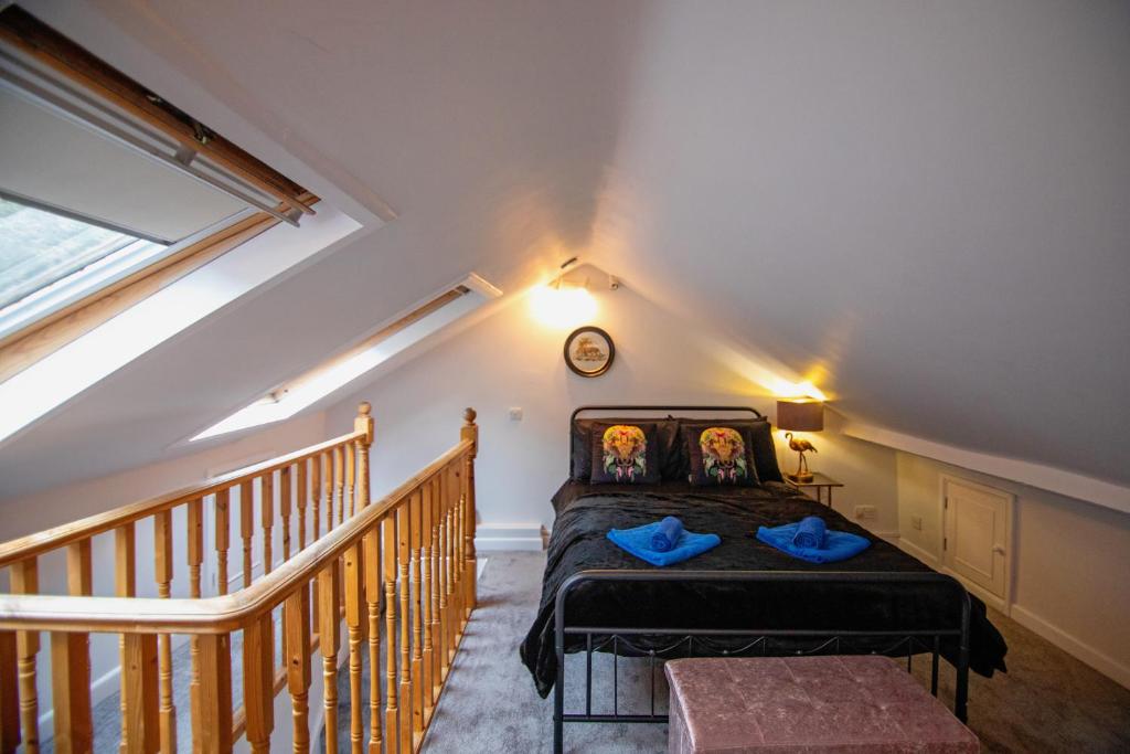 a bedroom with a bed and a clock on the wall at Winchester City House in Winchester
