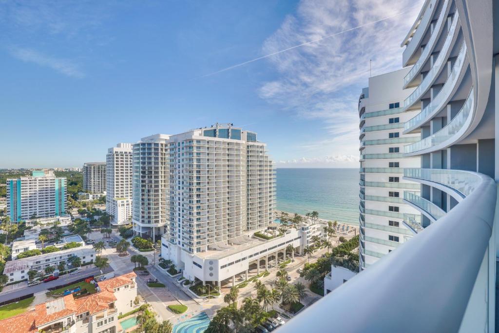 a view of the ocean from the balcony of a building at Steps to Fort Lauderdale Beach Oceanfront Condo in Fort Lauderdale