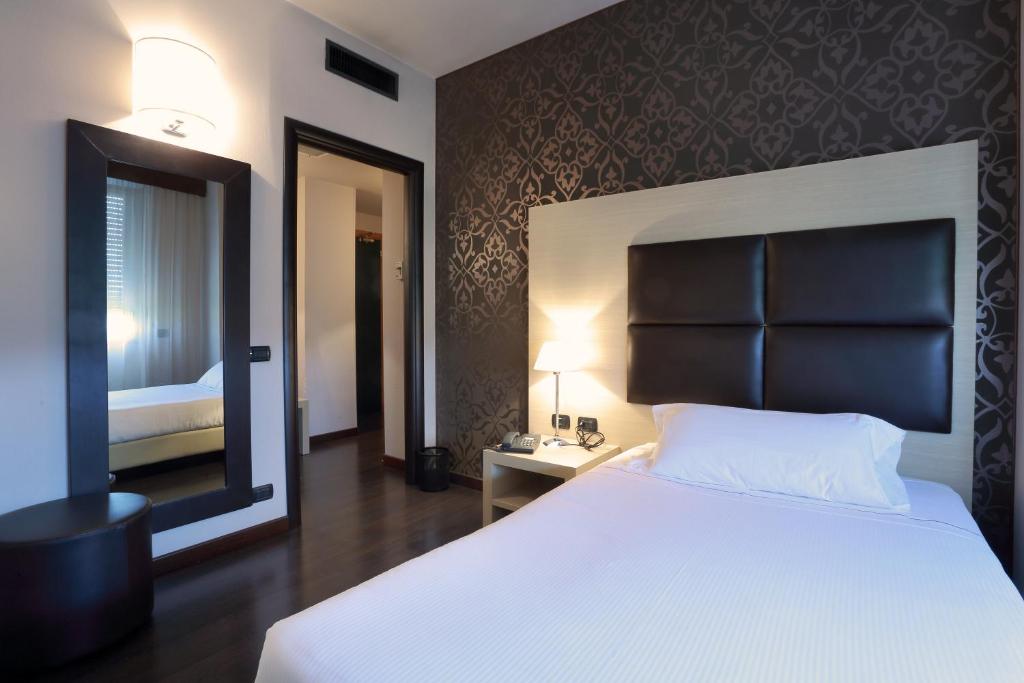Postel nebo postele na pokoji v ubytování Hotel La Torretta