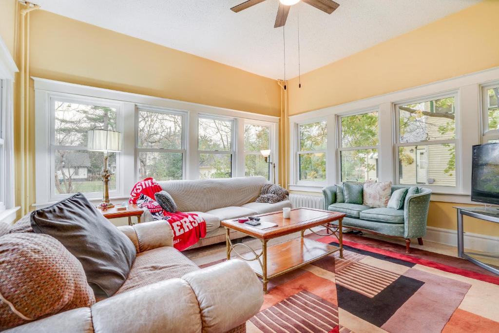a living room with a couch and a table at Eau Claire Retreat Close to Campus and Dtwn! in Eau Claire
