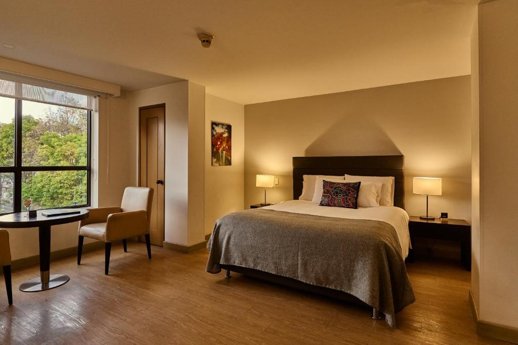 Postel nebo postele na pokoji v ubytování Hotel Parque 97 Suites