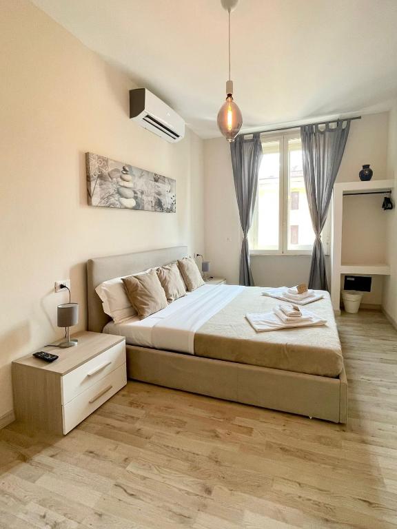 Postel nebo postele na pokoji v ubytování San Pietro Rooms 84