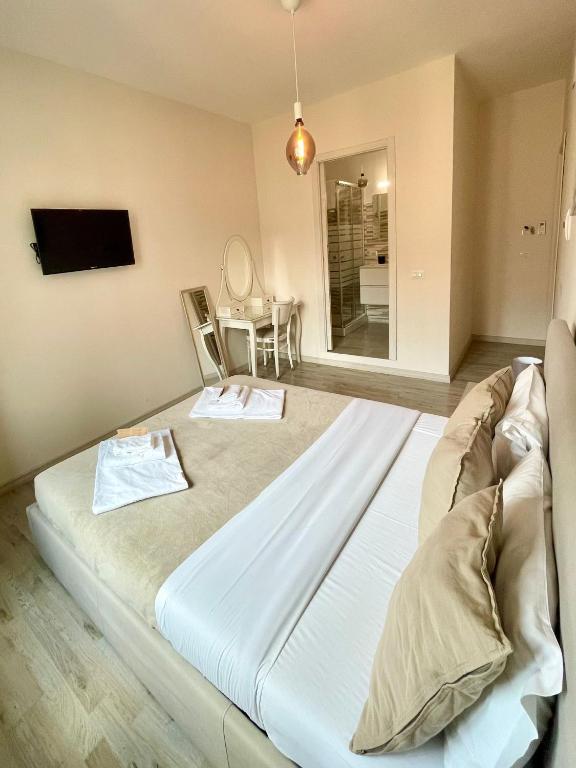 Postel nebo postele na pokoji v ubytování San Pietro Rooms 84