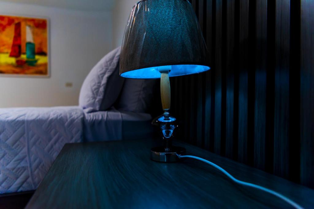 Postel nebo postele na pokoji v ubytování El Colibri Hotel