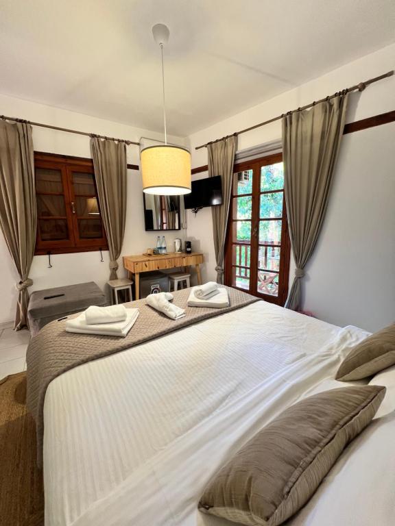 Postel nebo postele na pokoji v ubytování GaliniCafe22-suites