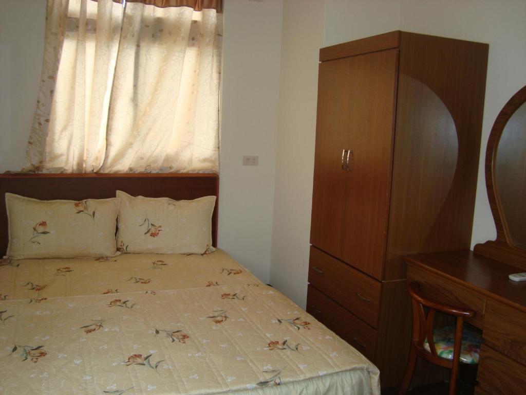 Postel nebo postele na pokoji v ubytování Fu Yuan B&B