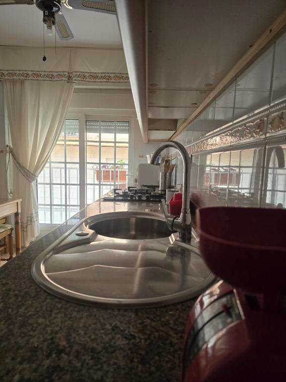 a kitchen counter with a sink and a sink at apartamento alma in Almería