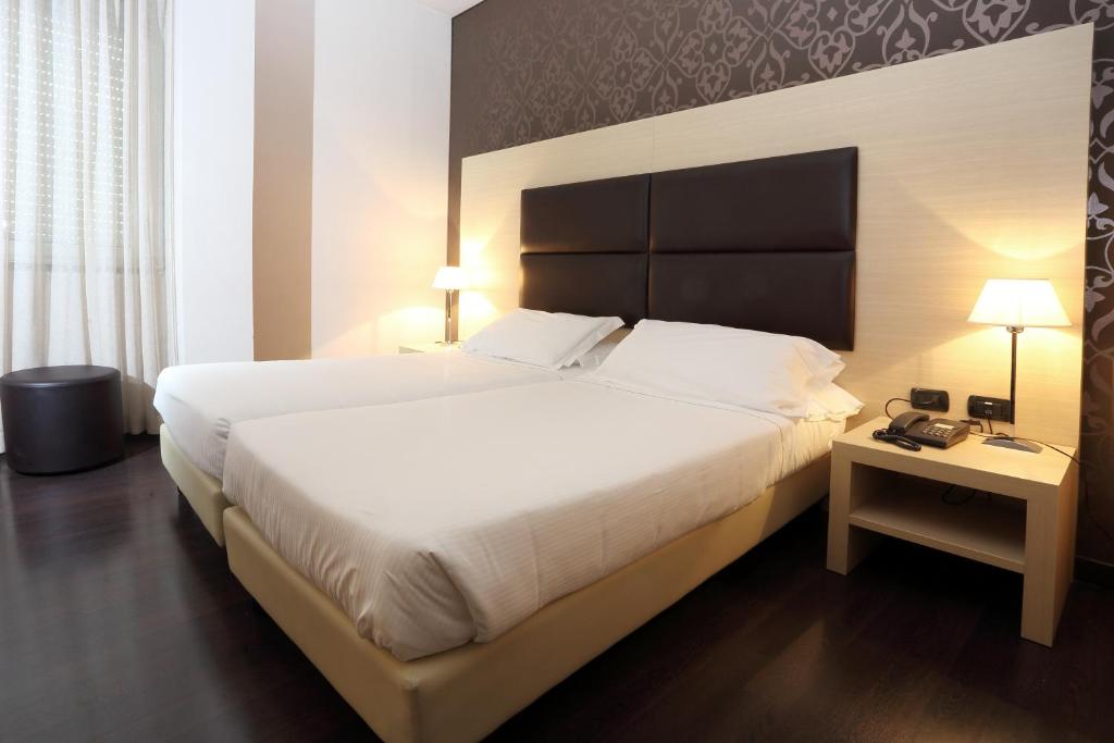 Postel nebo postele na pokoji v ubytování Hotel La Torretta