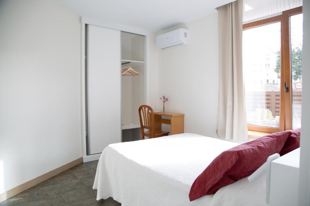 Posteľ alebo postele v izbe v ubytovaní Apartamentos Playa De Cóbreces