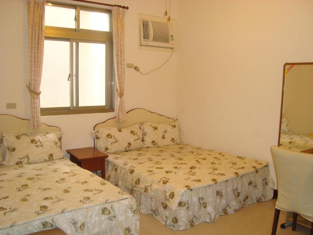 Postel nebo postele na pokoji v ubytování Fu Yuan B&B