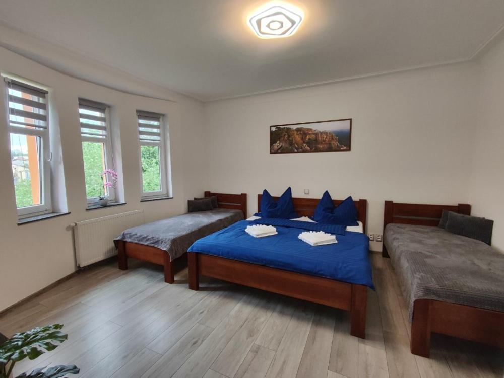 Postel nebo postele na pokoji v ubytování Vila Věrka
