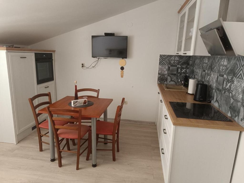 Kuchyň nebo kuchyňský kout v ubytování Apartments Antonia
