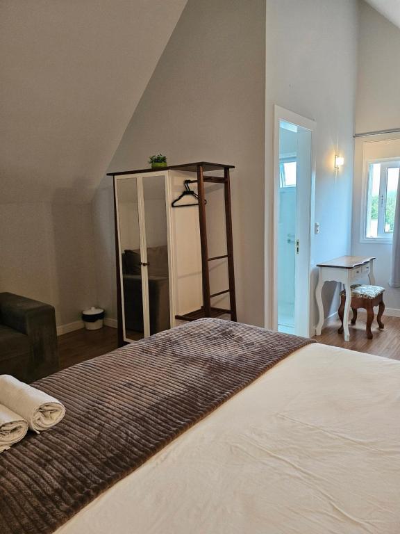 Postel nebo postele na pokoji v ubytování Pousada Behling Haus
