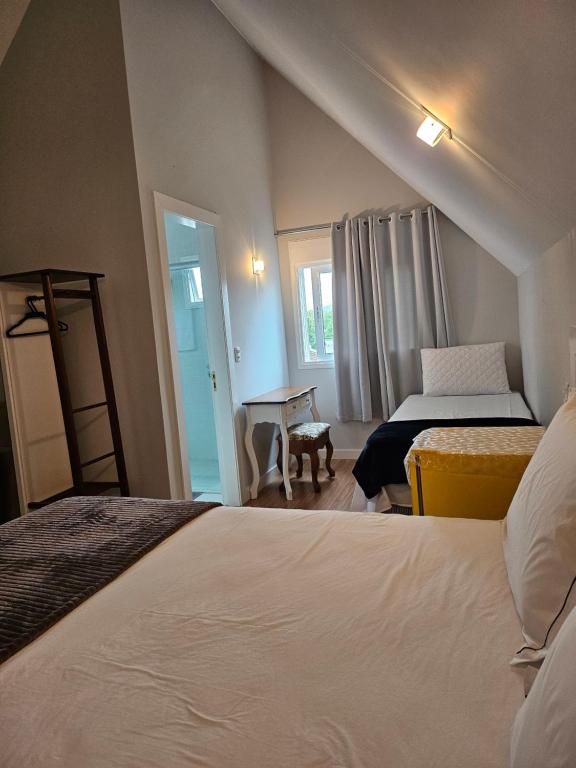 Postel nebo postele na pokoji v ubytování Pousada Behling Haus