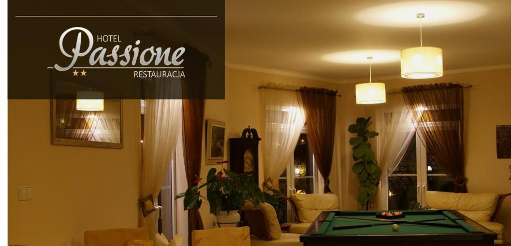 a living room with a pool table in it at Hotel Passione in Bielsko-Biała