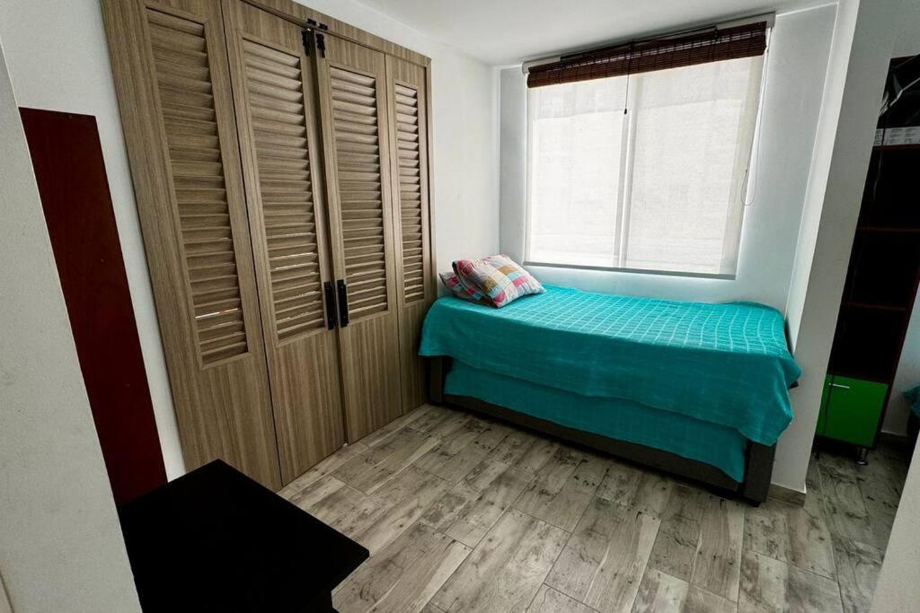 Postel nebo postele na pokoji v ubytování PA Lindo Apartamnto con Aire A