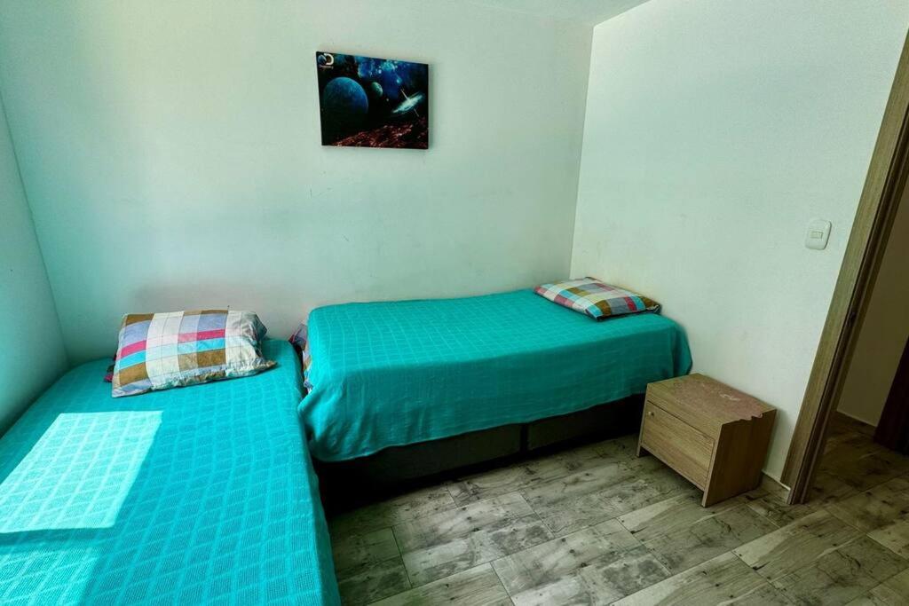 Postel nebo postele na pokoji v ubytování PA Lindo Apartamnto con Aire A