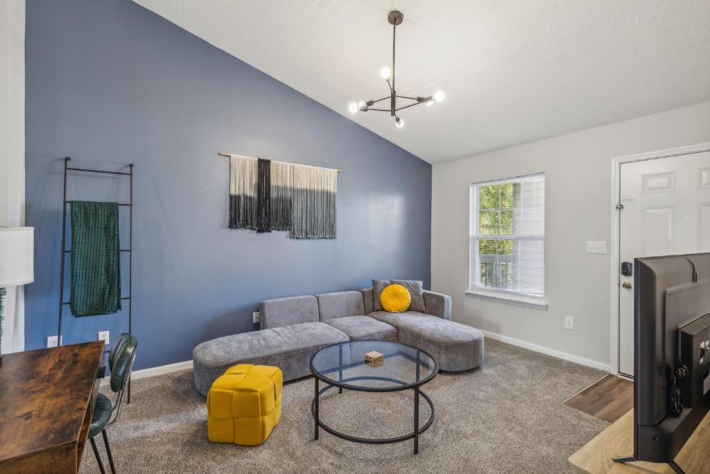 a living room with a couch and a table at Cb 3508-301 Fayetteville Oasis I Modern, Comfy in Fort Bragg