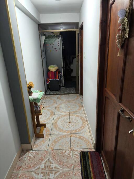 a hallway with a tile floor in a house at Listo para habitar in La Paz