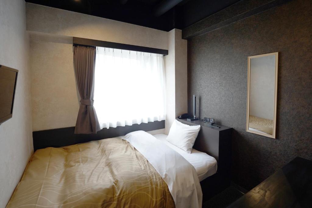 Postel nebo postele na pokoji v ubytování Hotel Chino