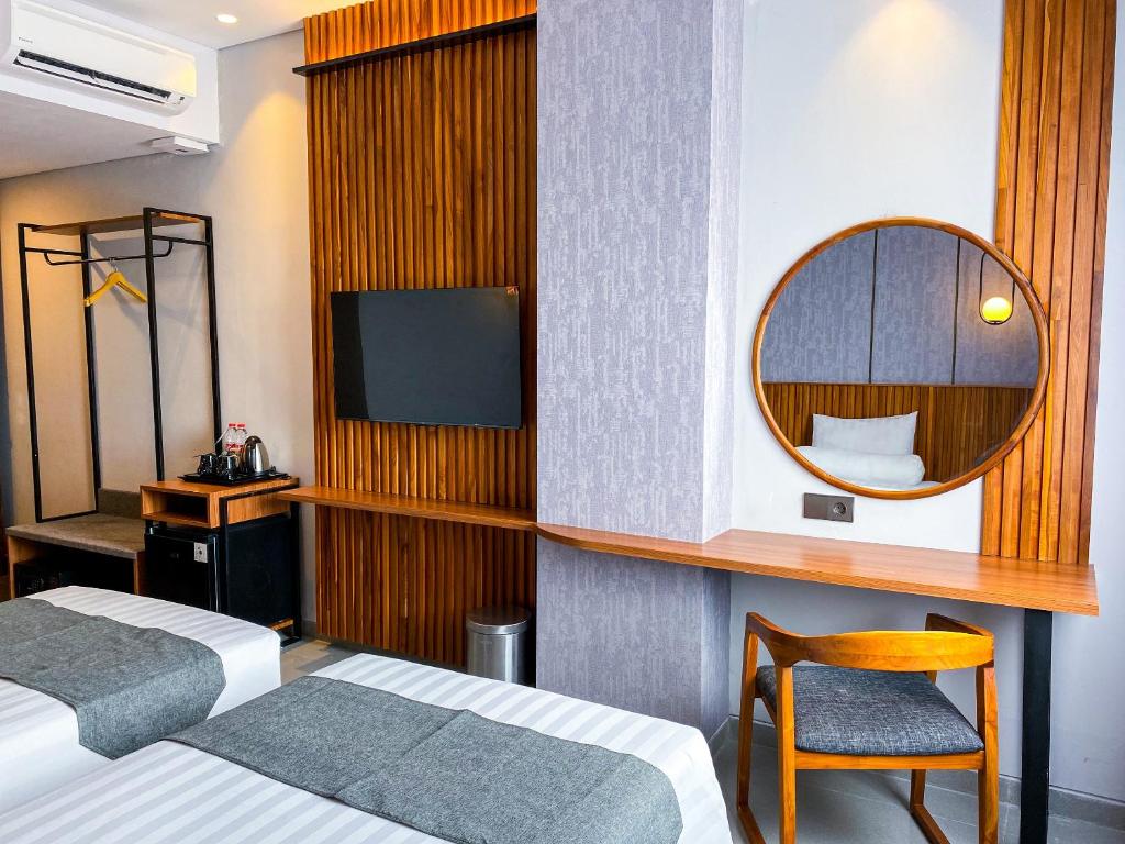 Postel nebo postele na pokoji v ubytování Nata Azana Hotel Ngawi