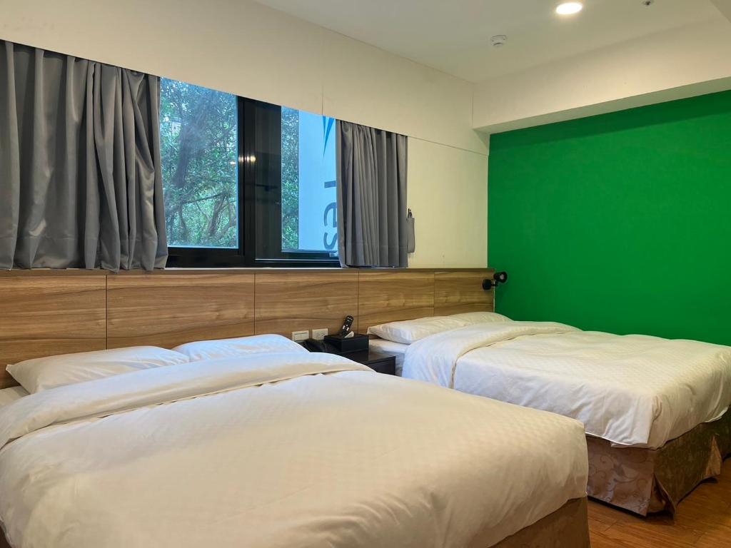 Postel nebo postele na pokoji v ubytování 悦心旅Yesing Hotel