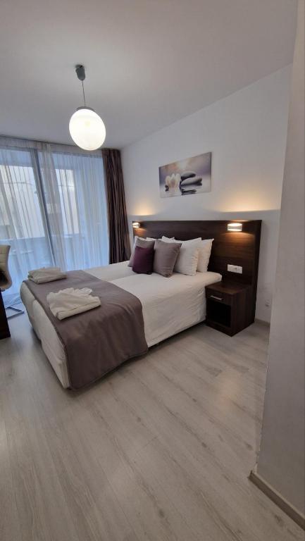 Postel nebo postele na pokoji v ubytování International Atene hotel