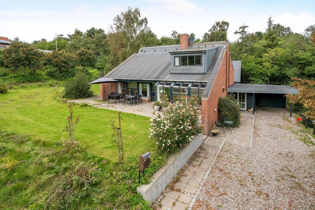 an aerial view of a house with a garden at Cozy House On Helgenæs in Knebel