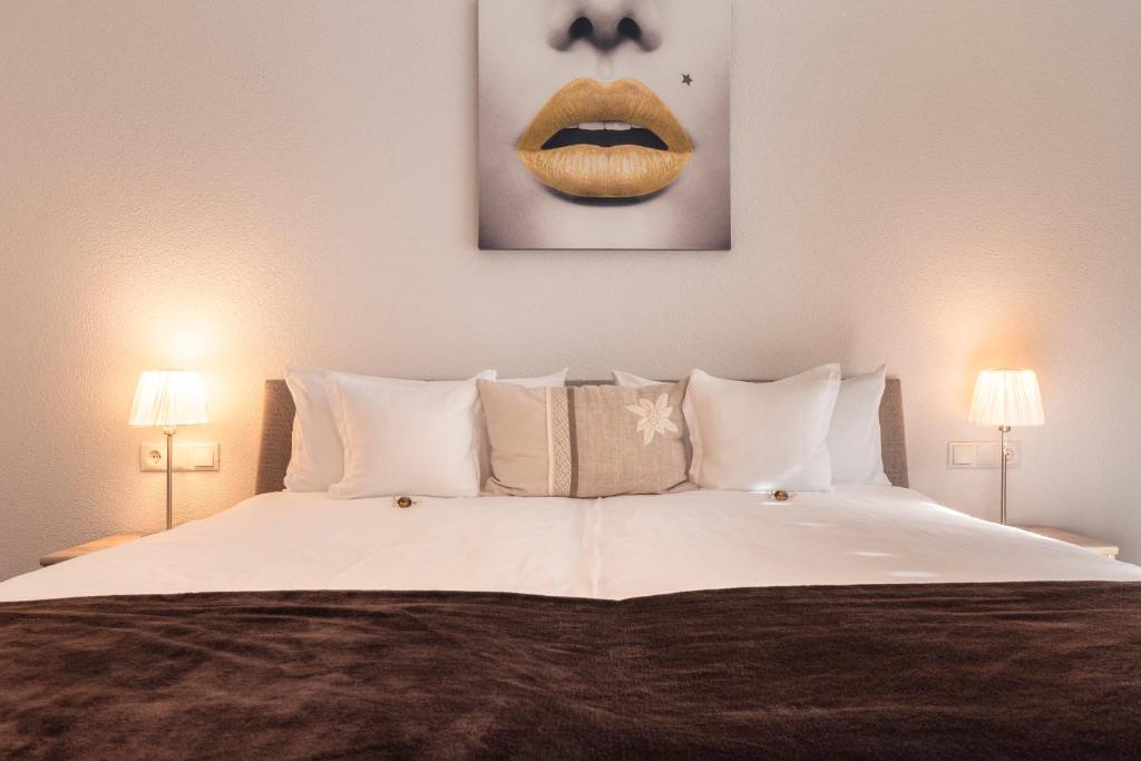 Posteľ alebo postele v izbe v ubytovaní Alpen-Appartements Zürcher