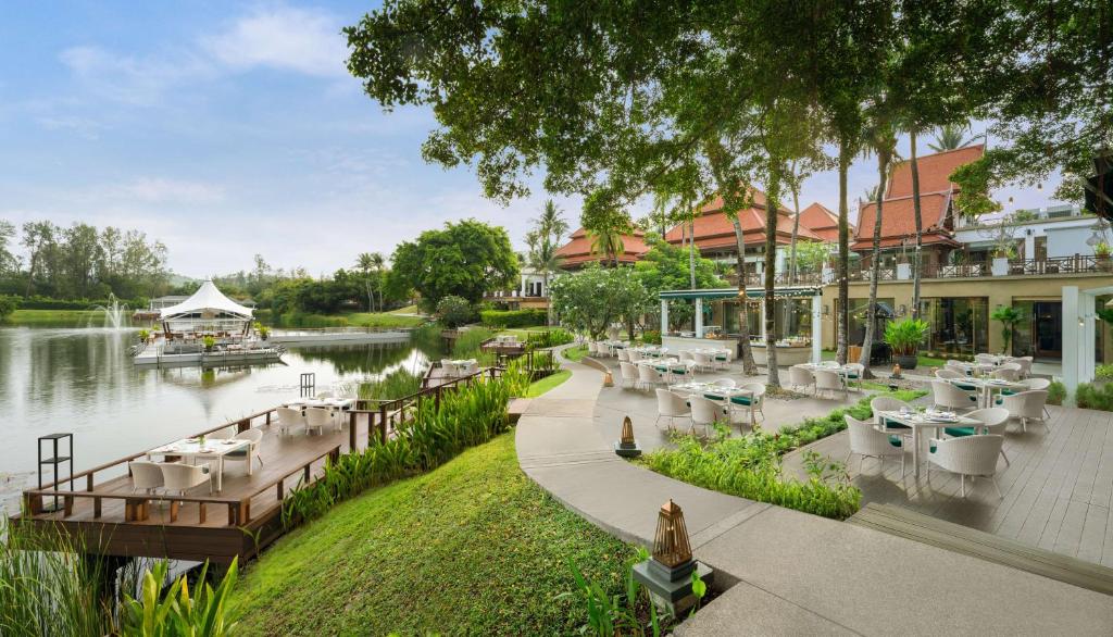 a rendering of a restaurant next to a river at Banyan Tree Phuket in Bang Tao Beach