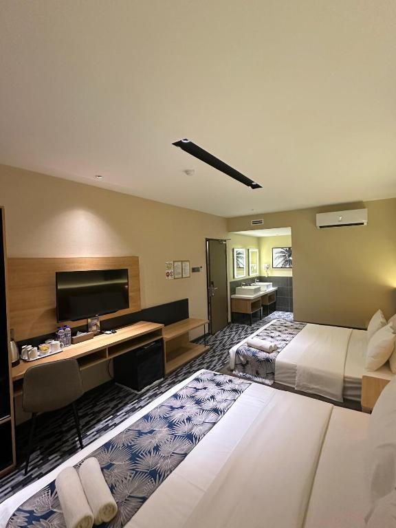 Postel nebo postele na pokoji v ubytování NB HOTEL