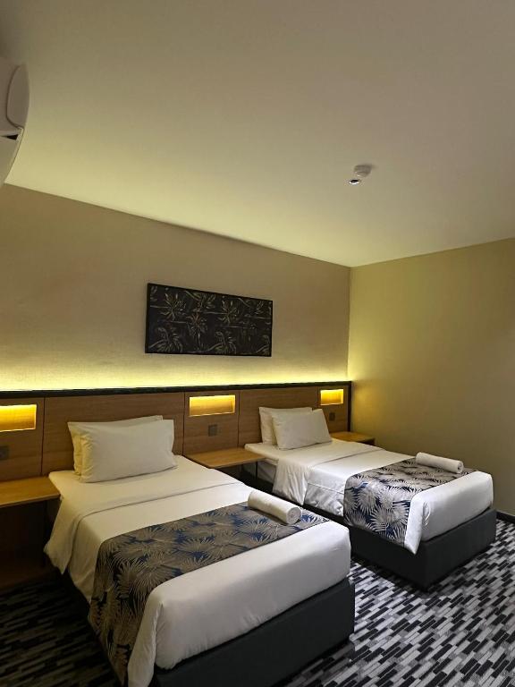 Postel nebo postele na pokoji v ubytování NB HOTEL