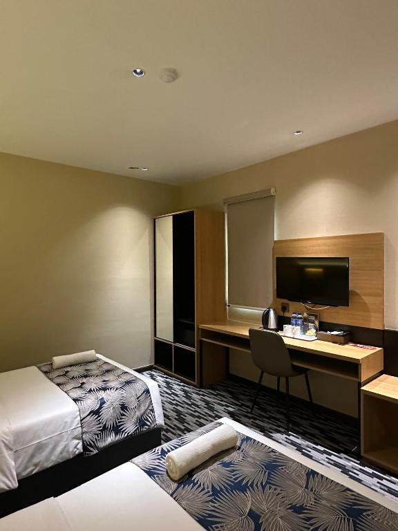 Postel nebo postele na pokoji v ubytování NB HOTEL