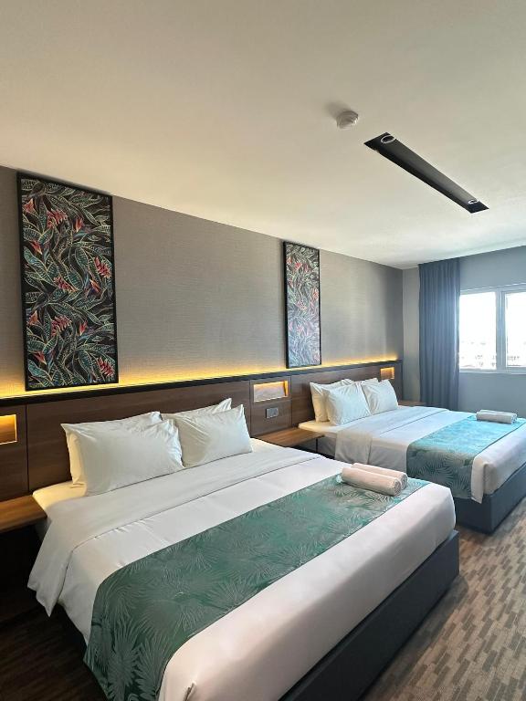 Postel nebo postele na pokoji v ubytování NB HOTEL