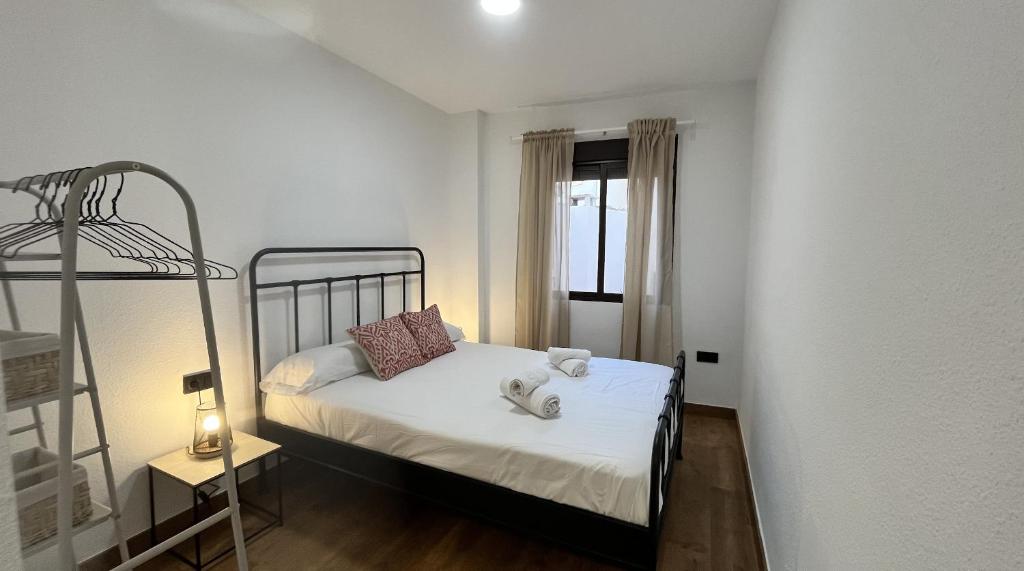 Posteľ alebo postele v izbe v ubytovaní Apartamento MMG