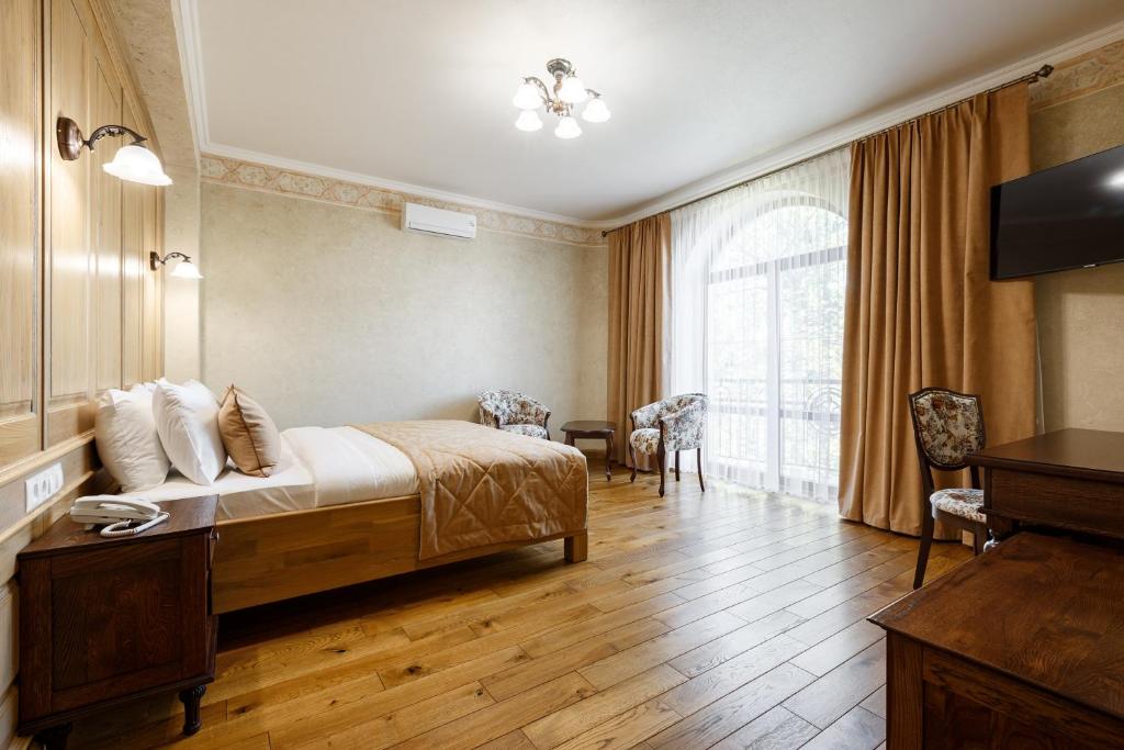 Postel nebo postele na pokoji v ubytování GANZ HOTEL