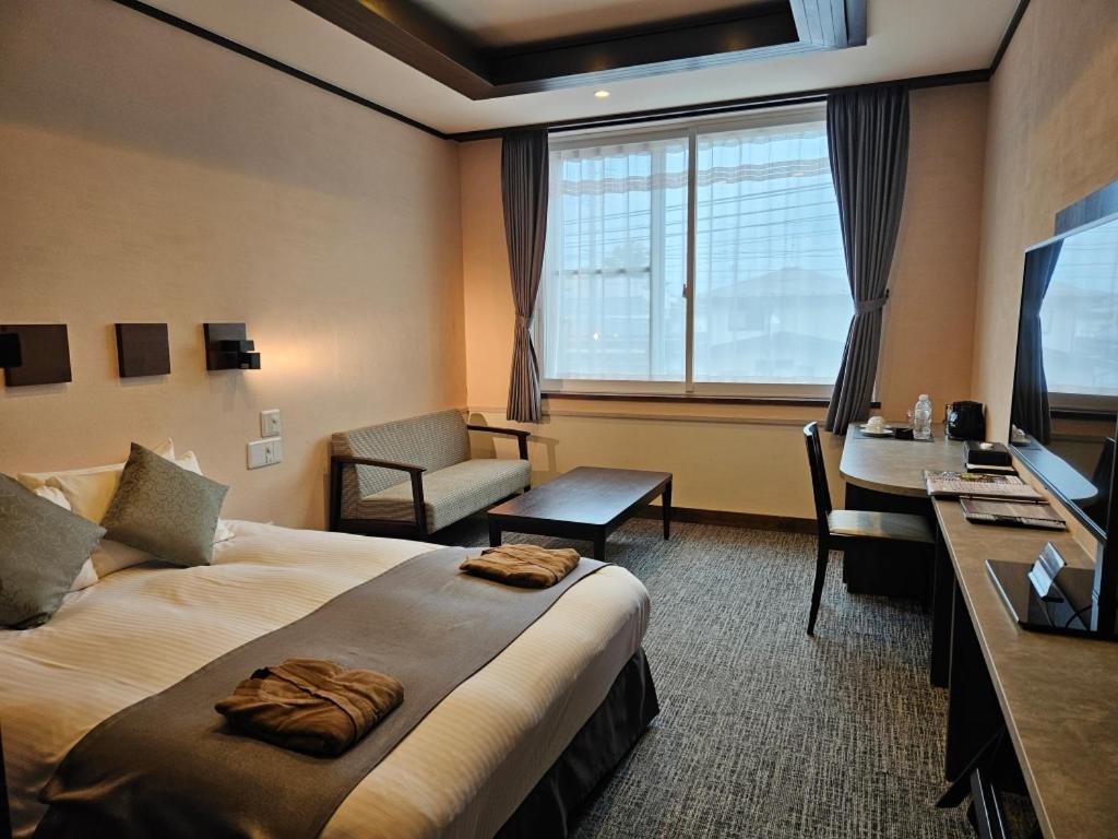 Postel nebo postele na pokoji v ubytování Hotel Grand Vert Kyu Karuizawa