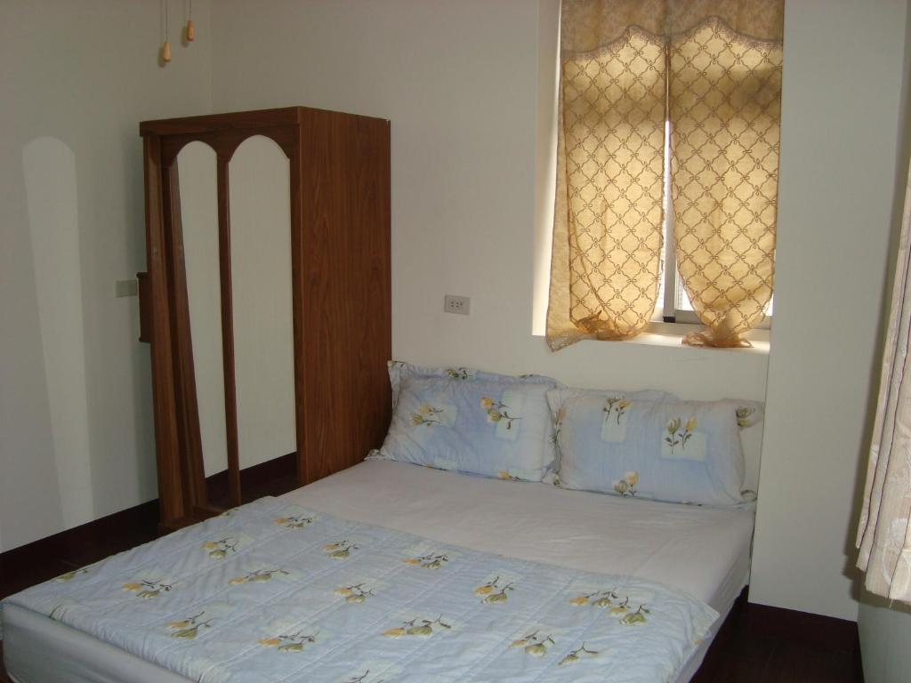 Postel nebo postele na pokoji v ubytování Fu Yuan B&B