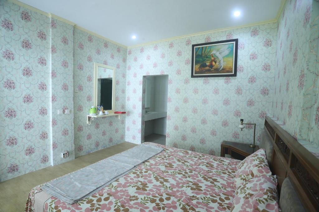 Postel nebo postele na pokoji v ubytování De Karanganjar Inn