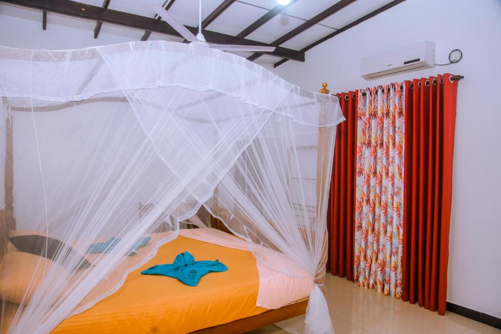 Postel nebo postele na pokoji v ubytování Brave resort Mirissa