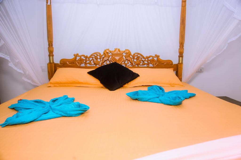 Postel nebo postele na pokoji v ubytování Brave resort Mirissa