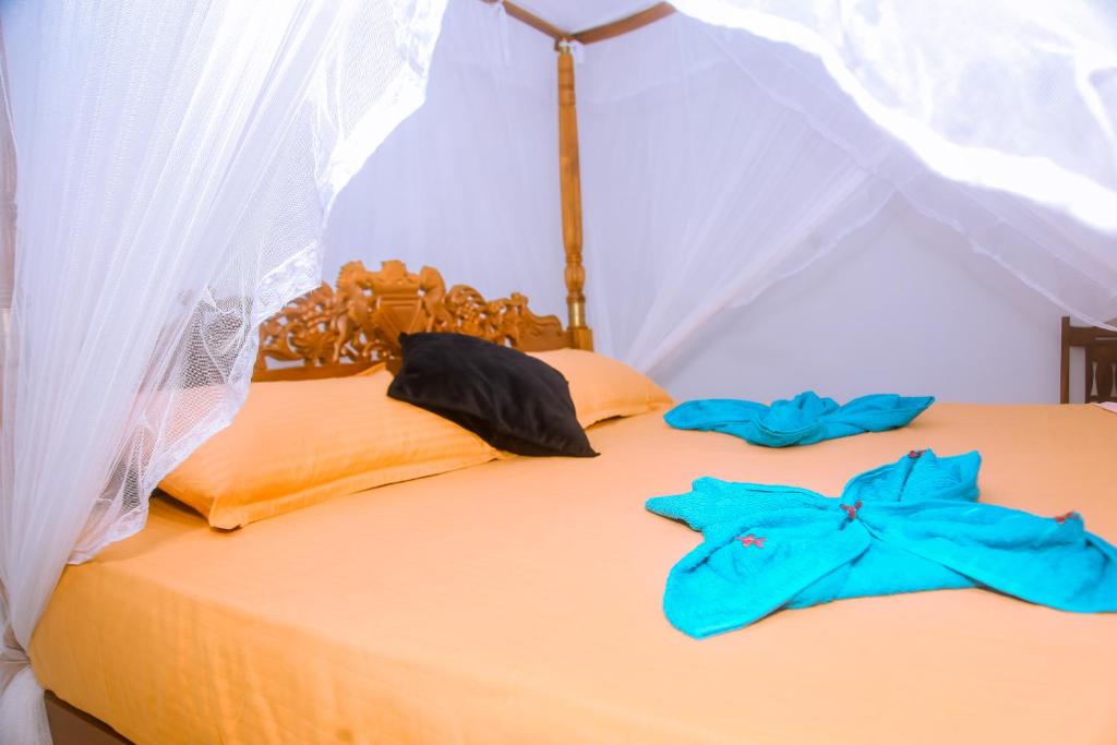 Postel nebo postele na pokoji v ubytování Brave resort Mirissa