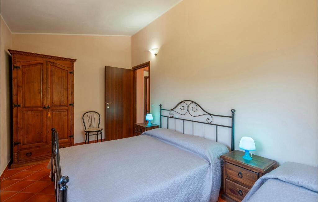 A bed or beds in a room at Valguerriera - Rosa Bianca