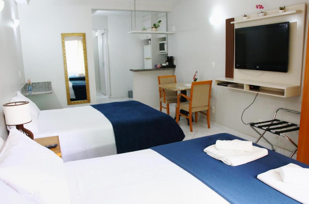 Postel nebo postele na pokoji v ubytování Flats em frente ao Allianz Parque - HOTEL EM PERDIZES